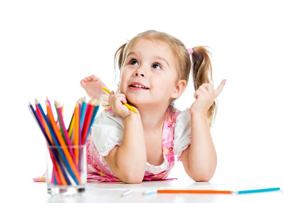 Girl thinking while holding colouring cryons